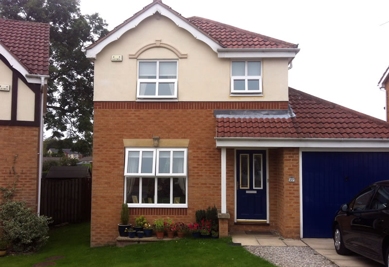 White upvc windows with astragal bars