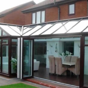rosewood-conservatory-bifolds rosewood conservatory with bi-folding doors in Yorkshire