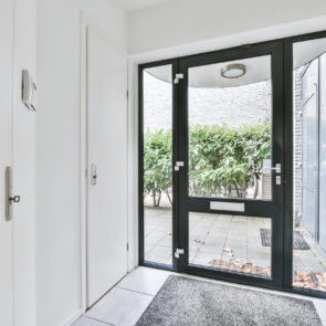 Cute design of the entrance to the house Cute design of the entrance to the house with a glass door